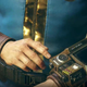 A Fallout 76 Vault Dweller consults their Pipboy.
